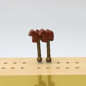 Handcrafted Red Angus Cow cribbage pegs featuring detailed brown-red cattle designs with realistic markings, perfect for farm-themed cribbage boards and cattle lovers.