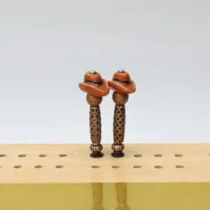 Cowboy Hat Cribbage Pegs: Handcrafted decorative cribbage pegs shaped like classic cowboy hats, featuring detailed western-style hats on durable peg bases, designed to add a rustic, playful touch to any cribbage board.